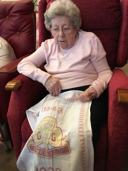Jean reminiscing about the Trefoil Guild with one of her old tea towels